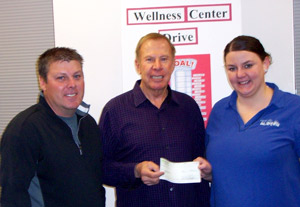 1000 dollar donation to Glidden Wellness Center - John McLaughlin, Mike McLaughlin, Jessica Burns