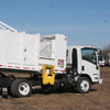 Rear Side View of a New Way Mamba Satellite Side Loader in action